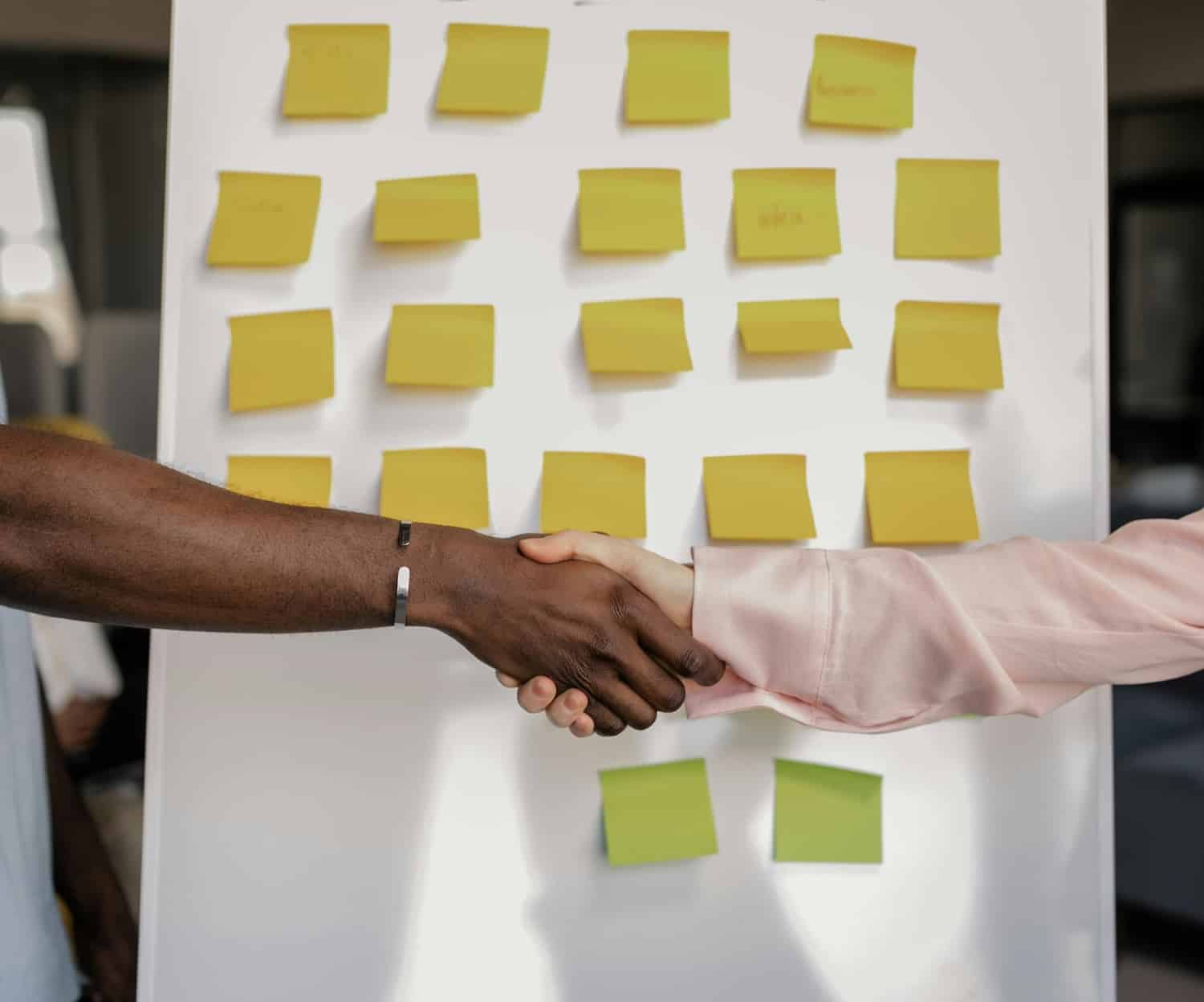 Two people shaking hands for a brand partnership on Pinterest.