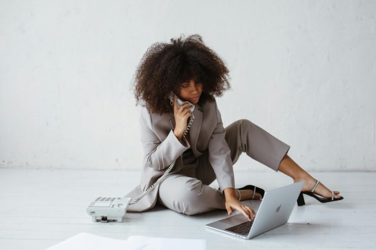 A woman on her laptop researching how to make money on Pinterest.